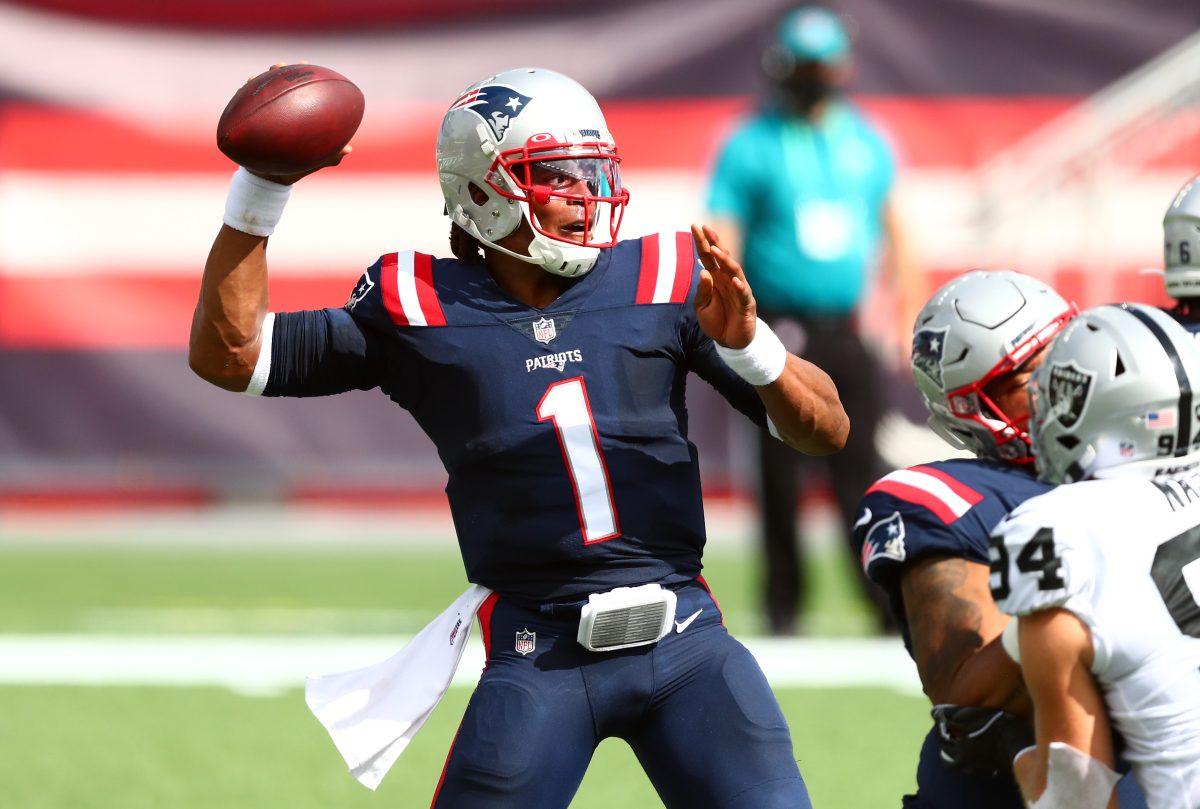 FOXBOROUGH, MASSACHUSETTS - SEPTEMBER 27: Cam Newton #1 of the New England Patriots throws a pass during the first half against the Las Vegas Raiders at Gillette Stadium on September 27, 2020 in Foxborough, Massachusetts. (Photo by Adam Glanzman/Getty Images)