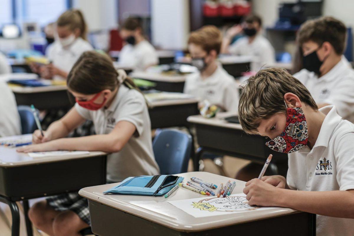 Students work at their desks on the first day of the new school year at St. Matthew School in Franklin, Tenn., Aug. 6, 2020, with extensive COVID-19 protocols in place, including temperature screening and mandatory face masks for each student. The U.S. Sixth Circuit Court of Appeals heard arguments from Resurrection School, July 21, 2021, a Catholic school in Lansing, Mich., on whether requiring Michigan students to wear masks in classrooms violates their constitutional rights. (CNS photo/Rick Musacchio, Tennessee Register)
